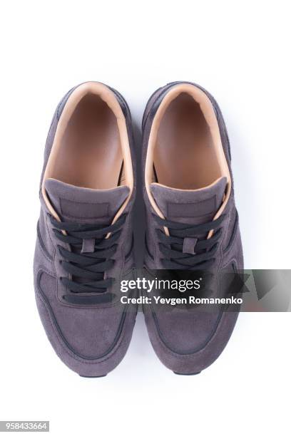 suede sneakers isolated on white background - leather training shoes stock-fotos und bilder