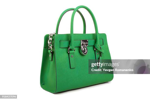 green leather women's handbag on white background - blue purse fotografías e imágenes de stock