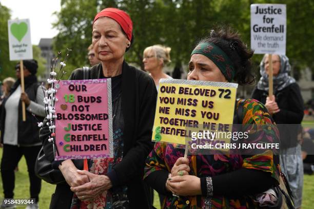 Demonstrators call for justice for the victims of the Grenfell Tower fire, during a protest opposite the Houses of Parliament in central London on...