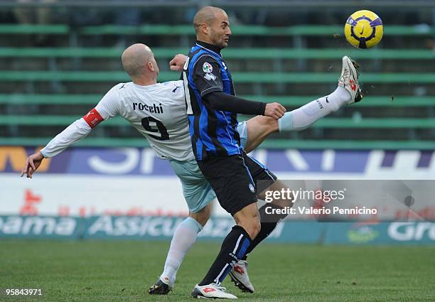 Paolo Bianco of Atalanta BC competes for the ball with Tommaso Rocchi of SS Lazio during the Serie A match between Atalanta BC and SS Lazio at Stadio...