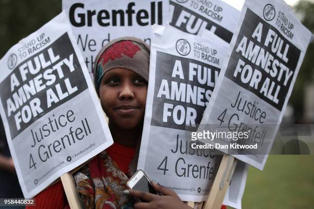 Protesters gather in Parliament Square as MP's debate ongoing concerns surrounding the official inquiry into the Grenfell fire disaster, on May 14,...