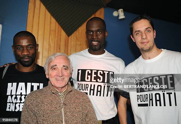 French singer Charles Aznavour , Slam poet Grand Corps Malade , former Taekwondo champion Pascal Gentil and rapper Passi pose while recording with a...