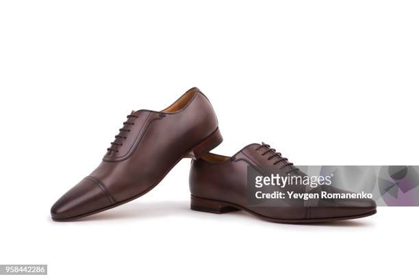 male shoes isolated on the white background - beautiful male feet stock-fotos und bilder