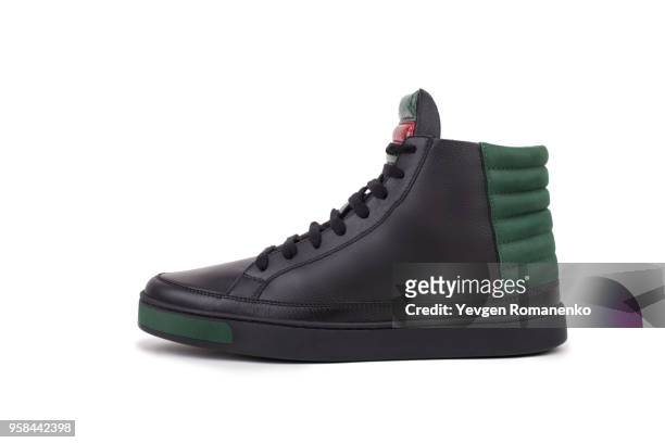 side view of black leather high-top sneaker, isolated on white background - suede shoe stock pictures, royalty-free photos & images