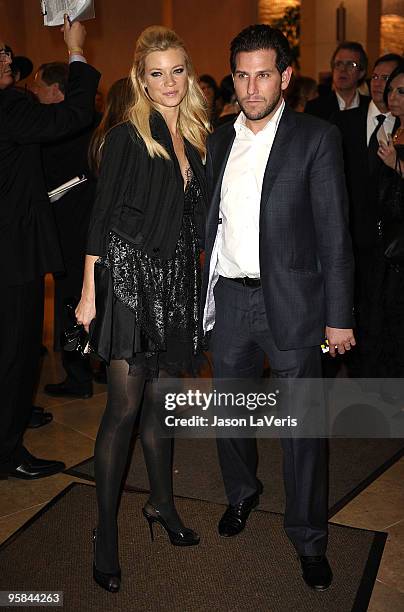 Actress Amy Smart and actor Branden Williams depart the 67th annual Golden Globe Awards at the Beverly Hilton Hotel on January 17, 2010 in Los...