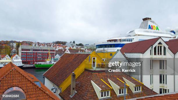 cruise ship aida cara over the roofs in stavanger norway - aida diva stock pictures, royalty-free photos & images
