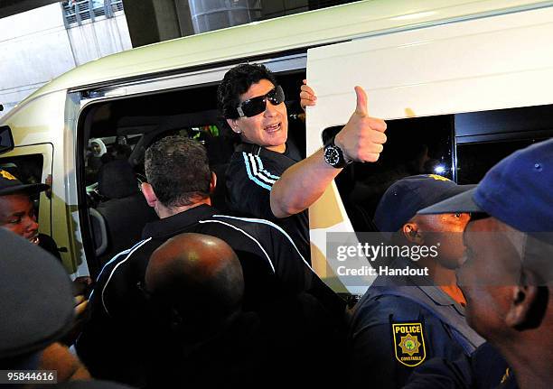 In this handout image provided by the 2010 FIFA World Cup Organising Committee South Africa, Argentina national soccer team manager Diego Maradona...