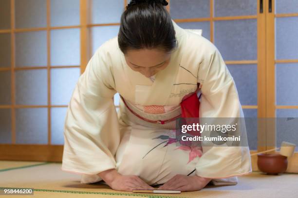 japanese manners - woman bowing stock pictures, royalty-free photos & images