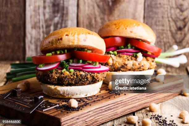 chickpea veggie burger with fresh vegetables - sesam stock-fotos und bilder