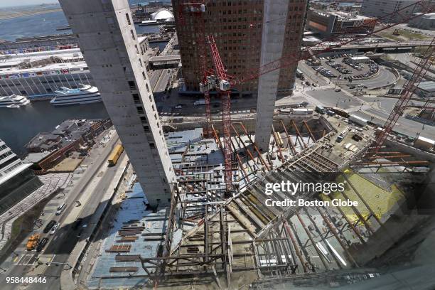 Elevator shafts rise above the construction site of Echelon Seaport in Boston's Seaport District on May 2, 2018. Piece by piece, Bostons newest...