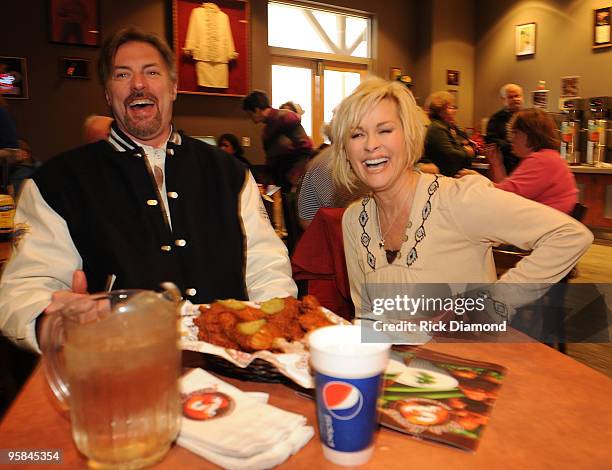 Country Artist Darryl Worley tries some of Country Artist Lorrie Morgan's Hot Chicken at the Country Crossing Grand Opening Kick-Off Celebration at...