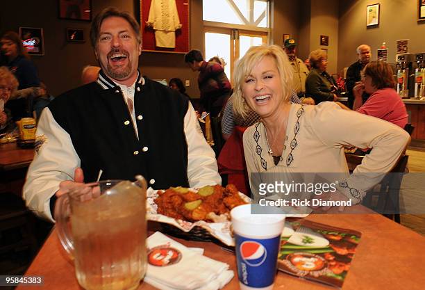 Country Artist Darryl Worley tries some of Country Artist Lorrie Morgan's Hot Chicken at the Country Crossing Grand Opening Kick-Off Celebration at...