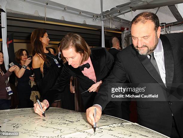 Director Wes Anderson and producer Joel Silver sign the Chrysler 300 Eco Style car for Stars for a Cause during the 67th annual Golden Globe Awards...