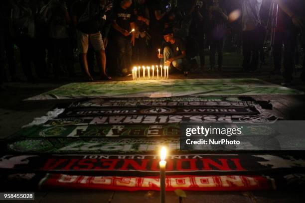 Dozens of people from Surabaya city, who are members of Surabaya soccer supporters , held a solidarity action in Taman Suropati, Jakarta on Monday,...