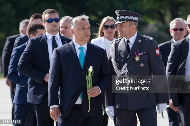 Hungarian Prime Minister Viktor Orban lay flowers at the Monument to the victims of the Smolensk crash in Warsaw, Poland on 14 May 2018