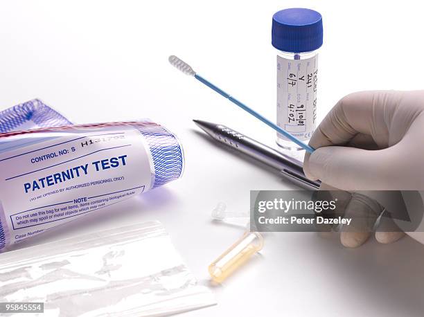 taking dna swab for paternity test. - dna test stock pictures, royalty-free photos & images