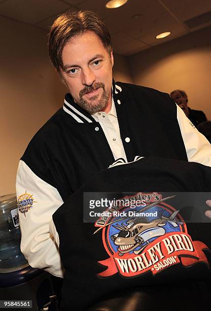 Country Artist Darryl Worley shows the Worley Bird Saloon's jacket at the ribbon cutting during the Country Crossing Grand Opening Kick-Off...