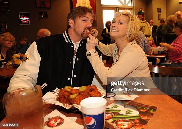 Country Artist Darryl Worley tries some of Country Artist Lorrie Morgan's Hot Chicken at the Country Crossing Grand Opening Kick-Off Celebration at...