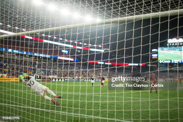 May 12: Sebastian Giovinco of Toronto FC scores from the penalty spot beating goalkeeper Matt Turner of New England Revolution during the New England...