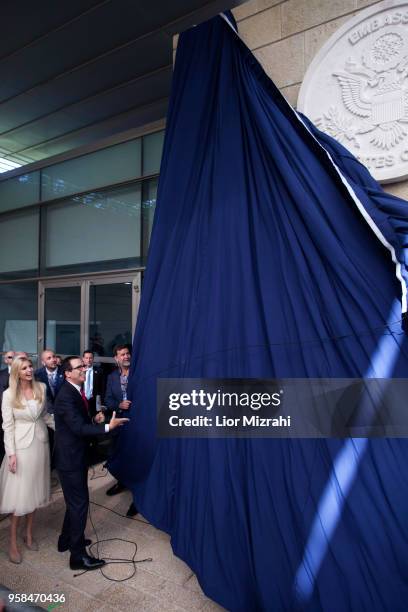 Treasury Secretary Steve Mnuchin and US President's daughter Ivanka Trump unveil an inauguration plaque during the opening of the US embassy in...