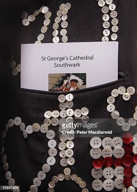 An order of service pokes out from the pocket of a pearly king at the funeral of London town crier Peter Moore at St George's Cathedral on January...