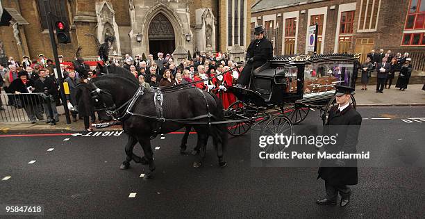 Horse drawn hearse carries the coffin of London town crier Peter Moore after a requiem mass held at St George's Cathedral on January 18, 2010 in...