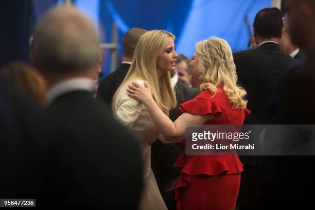 President's daughter Ivanka Trump kisses Israel Prime Minister wife Sara Netanyahu during the opening of the US embassy in Jerusalem on May 14, 2018...