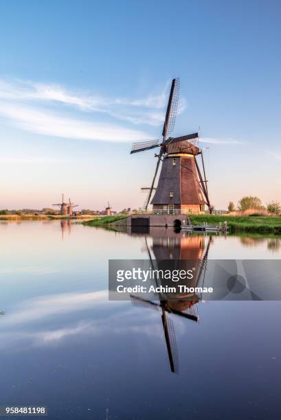 windmills, sunrise at kinderdijk, netherlands, europe - dutch culture stock pictures, royalty-free photos & images