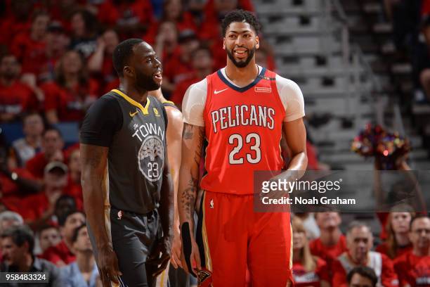 Draymond Green of the Golden State Warriors and Anthony Davis of the New Orleans Pelicans looks on during Game Four of the Western Conference...