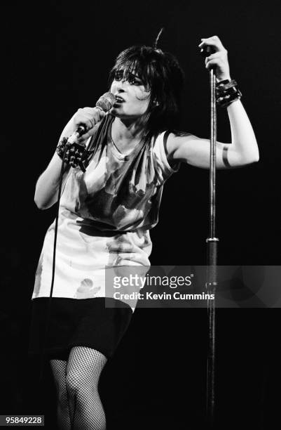 Siouxsie Sioux performs on stage with Siouxsie and the Banshees at the Apollo in Manchester, England on October 14, 1980.