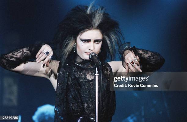 Siouxsie Sioux performs on stage with Siouxsie and the Banshees at the Apollo in Manchester, England on November 22, 1982.