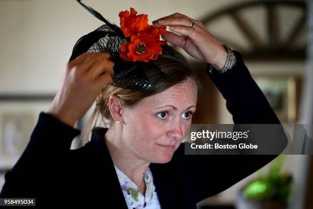 Amy Bucher positions her hat creation during a fascinator and tea party in a barn next to the historic Deane Winthrop House in Winthrop, MA on May...