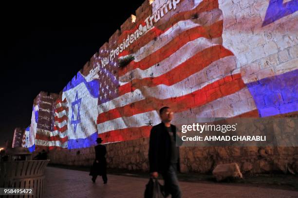 The Israeli and United States flags are projected on the walls of the ramparts of Jerusalem's Old City, to mark the opening of the new US embassy on...