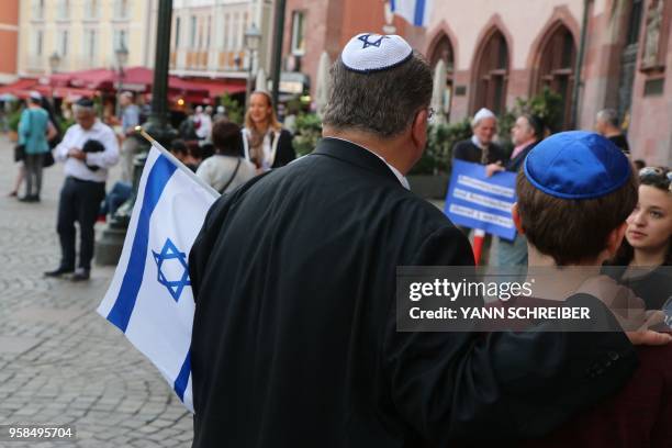 People wear the Kippa as part of the "Show Face and Kippa" initiative in Frankfurt am Main, central Germany on May 14, 2018. - Local politicians had...