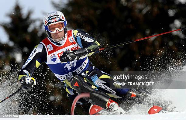 Norway's Aksel Lund Svindal clears a gate during the 2nd round of the FIS World Cup Men's Super combined-Slalom in Wengen on January 15, 2010. AFP...