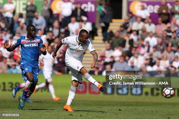 Badou Ndiaye of Stoke City and Jordan Ayew of Swansea City during the Premier League match between Swansea City and Stoke City at Liberty Stadium on...