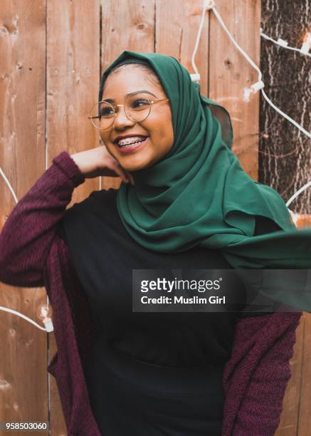 teen muslim girl wearing green hijab at a birthday party - muslimgirlcollection ストックフォトと画像