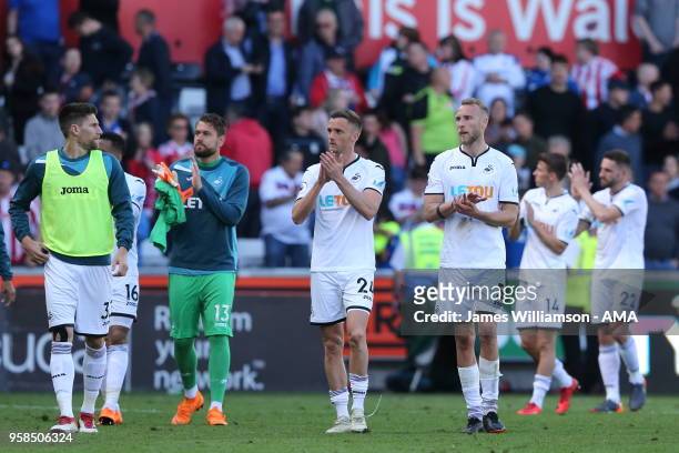 Andy King of Swansea City and Mike Van Der Hoorn of Swansea City during the Premier League match between Swansea City and Stoke City at Liberty...