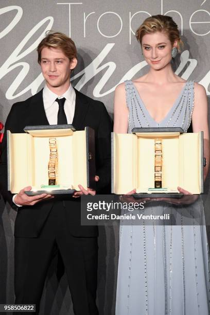 Actor Joe Alwyn and actress Elizabeth Debicki hold the throphy at Chopard Trophy photocall during the 71st annual Cannes Film Festival at Martinez...