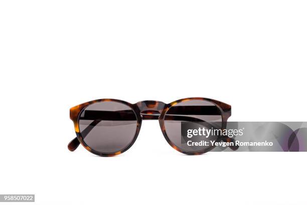 brown sunglasses isolated on white background - sunglasses foto e immagini stock