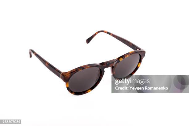 brown sunglasses isolated on white background - sunglasses without people stock-fotos und bilder