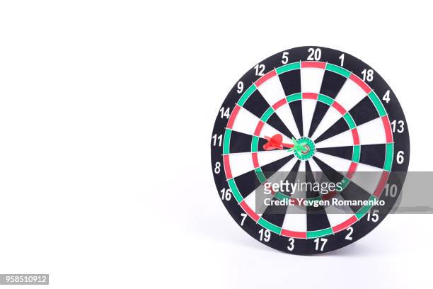 darts board isolated on white background. new dartboard for darts game. - dart board stock-fotos und bilder