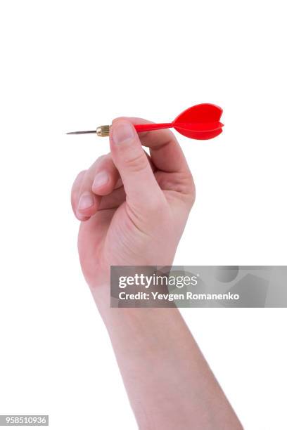 red dart in hand, isolated on white - throwing darts stock pictures, royalty-free photos & images