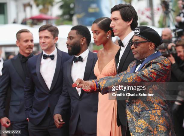 Actors Jasper Paakkonen, Topher Grace, John David Washington, Laura Harrier, Adam Driver, and director Spike Lee, wearing knuckle rings with love and...