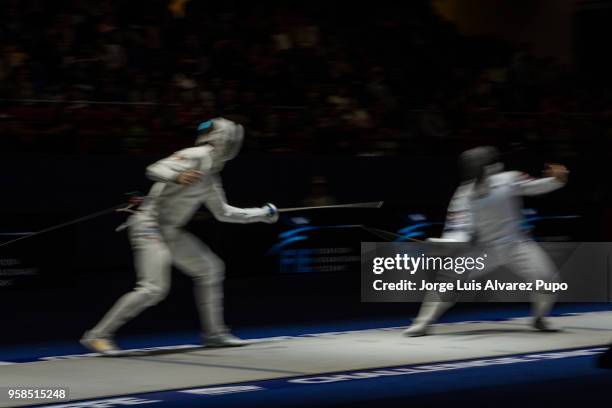 Daniel Berta of Hungary and Kyoungdoo Park of Korea compete during the Team's final of the Men's Epee World Cup, Sncf Reseau Challenge, at Salle...
