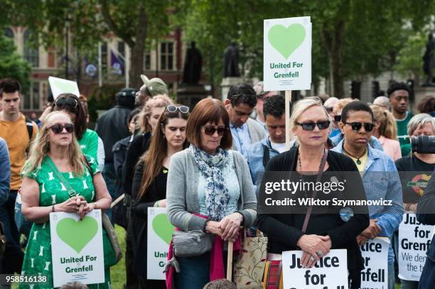 The Grenfell community of survivors, bereaved families and supporters gather in Parliament Square in central London in a peaceful protest as Members...