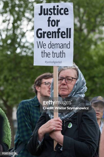 The Grenfell community of survivors, bereaved families and supporters gather in Parliament Square in central London in a peaceful protest as Members...