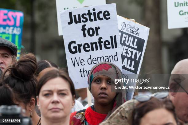 The Grenfell community of survivors, bereaved families and supporters gather in Parliament Square in central London in a peaceful protest as Members...