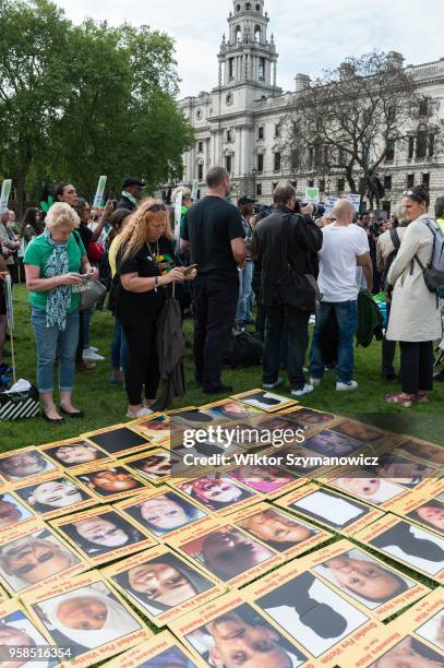 The Grenfell community of survivors, bereaved families and supporters gather in Parliament Square in central London in a peaceful protest as Members...