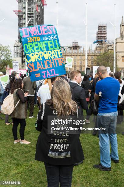 The Grenfell community of survivors, bereaved families and supporters gather in Parliament Square in central London in a peaceful protest as Members...